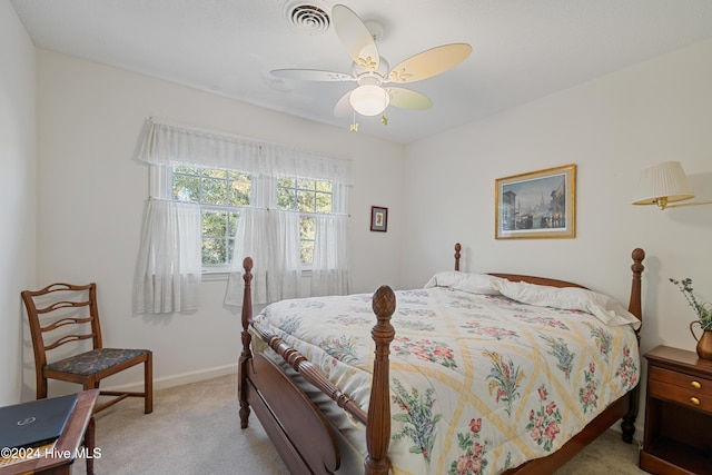 bedroom featuring light carpet and ceiling fan