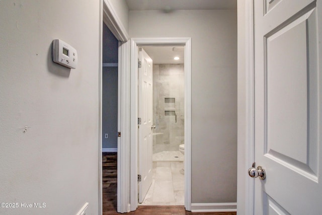 corridor featuring wood-type flooring