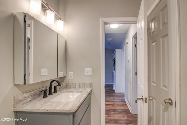 bathroom featuring vanity and hardwood / wood-style flooring