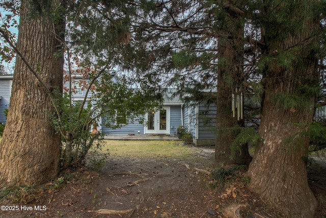 view of property exterior featuring french doors