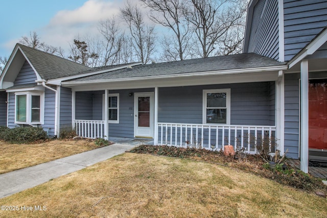 view of front of house featuring a front lawn and a porch