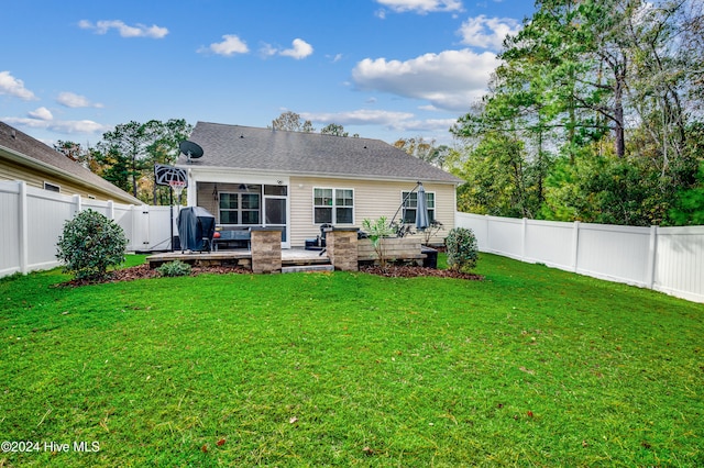 back of property featuring a lawn