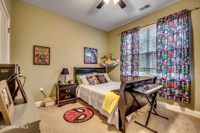 carpeted bedroom featuring ceiling fan