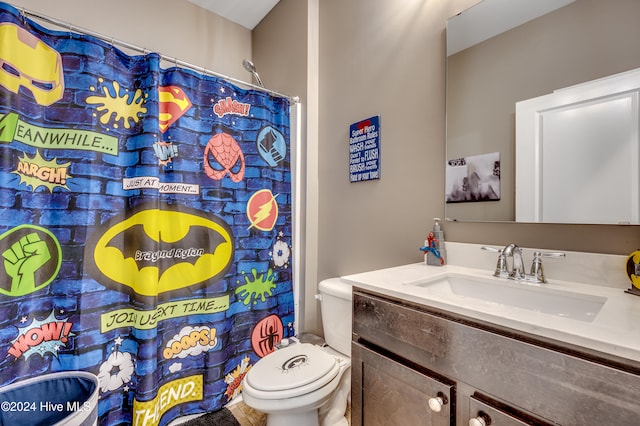 bathroom with vanity, toilet, and walk in shower