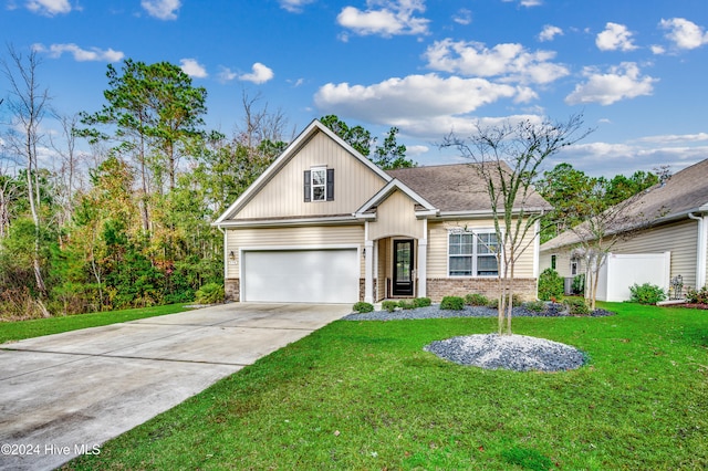 view of front of home featuring a garage and a front yard