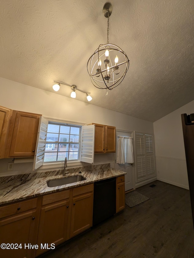 kitchen featuring light stone countertops, sink, black dishwasher, dark hardwood / wood-style floors, and pendant lighting