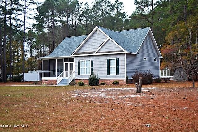 view of front facade featuring a sunroom