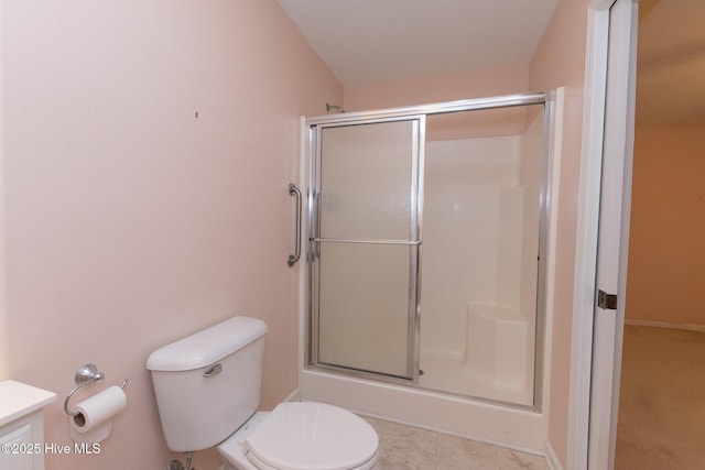 bathroom with vaulted ceiling, an enclosed shower, and toilet