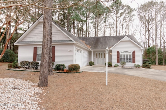 ranch-style house featuring a garage