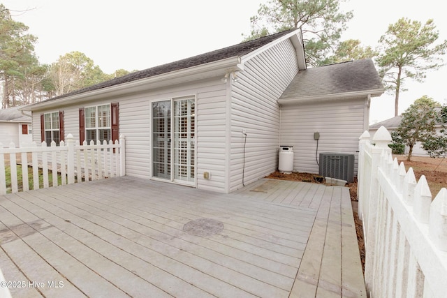 wooden deck featuring central air condition unit