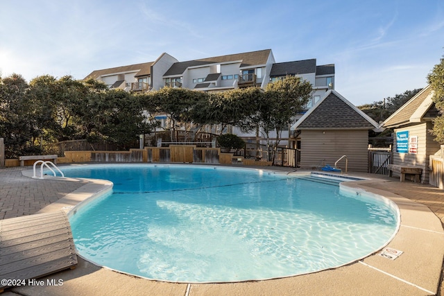 view of swimming pool with a patio area