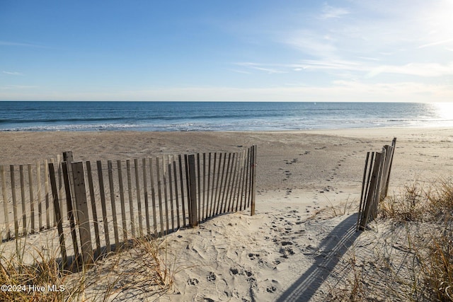 property view of water featuring a beach view