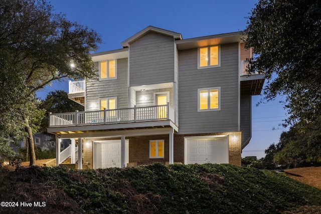 view of front of property with a balcony and a garage