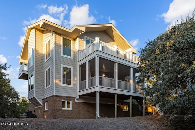 rear view of house featuring a balcony