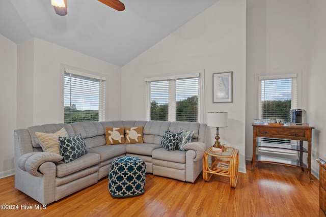 living room with a wealth of natural light, ceiling fan, and wood-type flooring