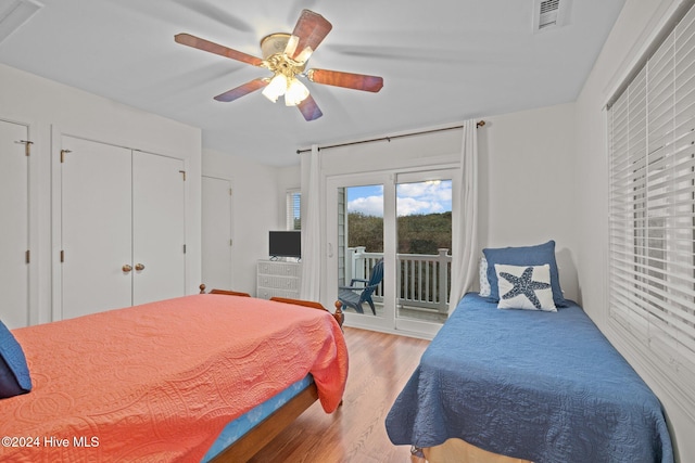 bedroom with ceiling fan, access to exterior, and light wood-type flooring