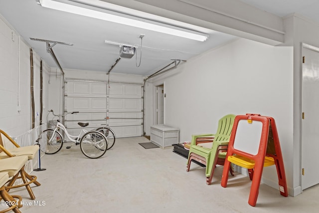 garage featuring a garage door opener