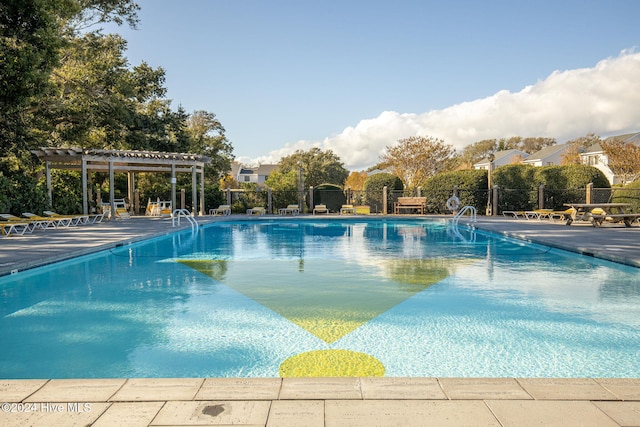 view of pool with a patio area and a pergola