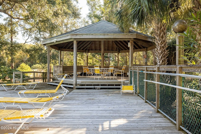 view of dock featuring a gazebo and a deck