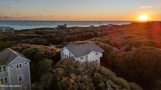 aerial view at dusk with a water view