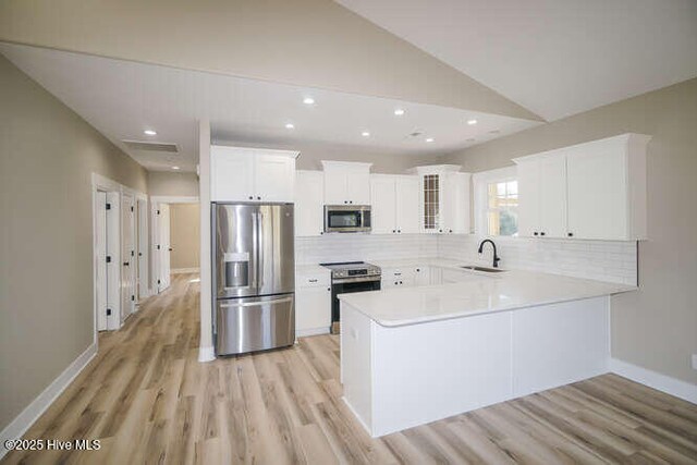 spare room with light hardwood / wood-style floors and ceiling fan