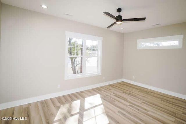 spare room with recessed lighting, wood finished floors, baseboards, and ceiling fan