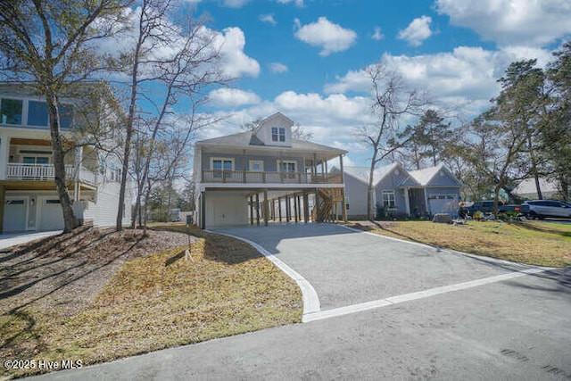 view of front facade with a carport and driveway