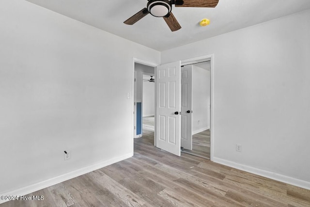 empty room featuring light hardwood / wood-style floors and ceiling fan