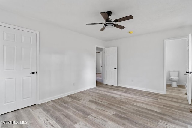 unfurnished bedroom with ensuite bath, ceiling fan, and light hardwood / wood-style floors