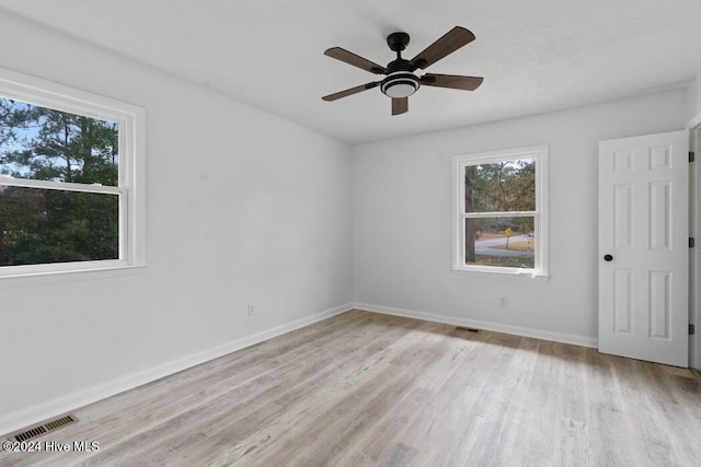 spare room with light hardwood / wood-style floors and ceiling fan