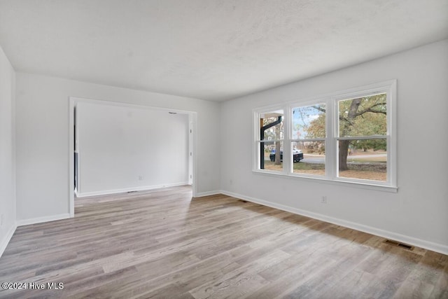 empty room with light wood-type flooring