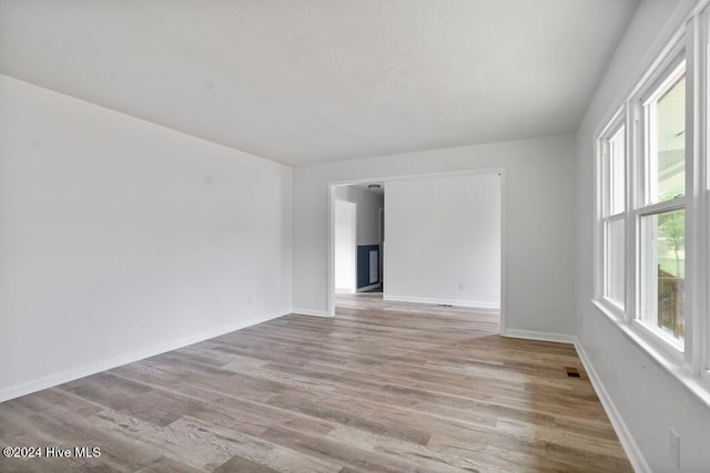 spare room featuring light hardwood / wood-style flooring