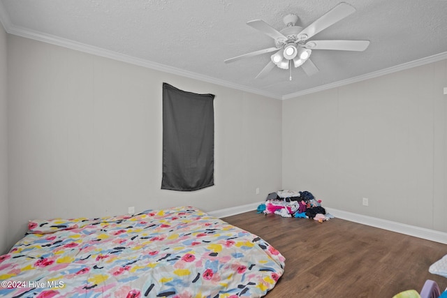 bedroom with a textured ceiling, ceiling fan, dark hardwood / wood-style flooring, and crown molding