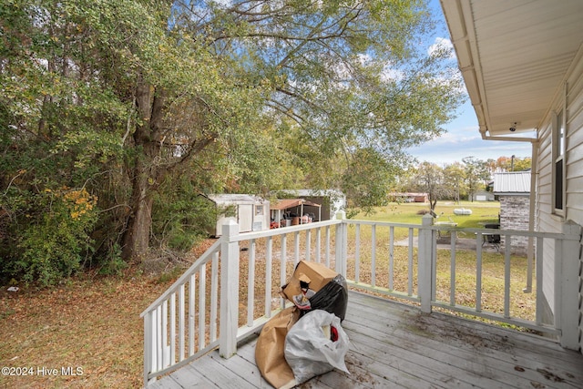 wooden deck with a yard