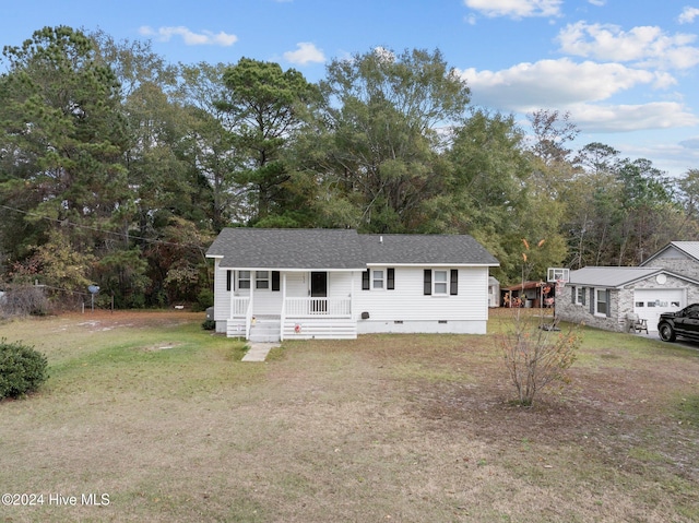 view of front facade with a front lawn and covered porch