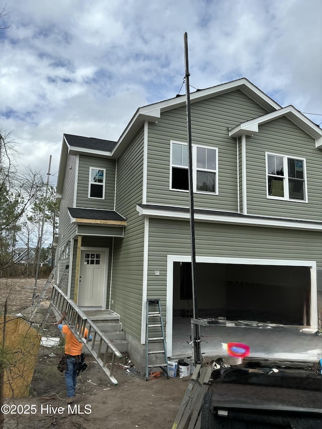 view of front of property featuring a garage