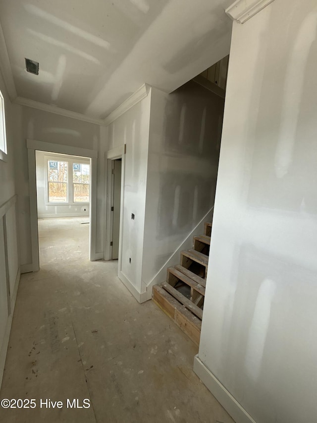 corridor featuring stairway, visible vents, and crown molding