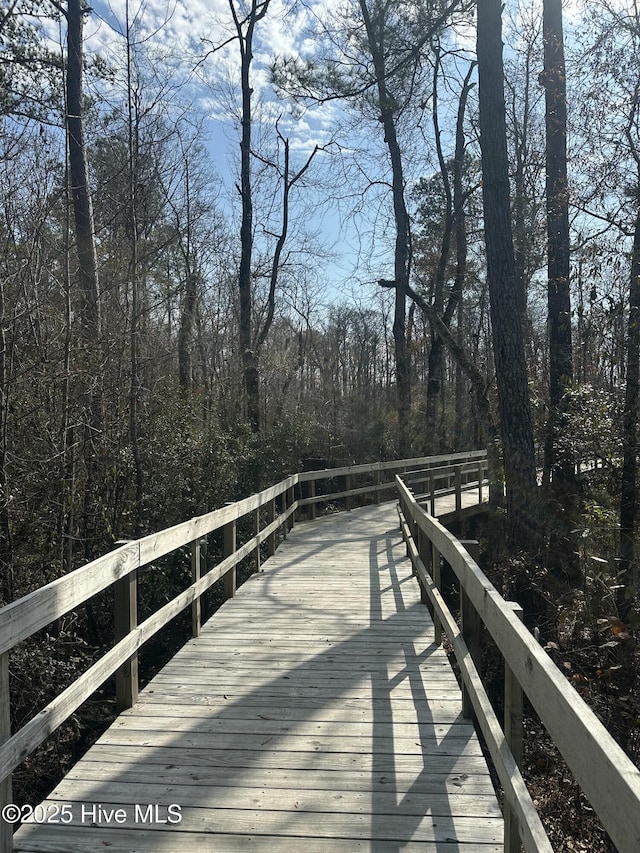 view of dock featuring a forest view