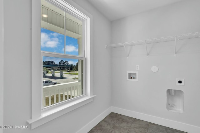 washroom with electric dryer hookup, plenty of natural light, and washer hookup