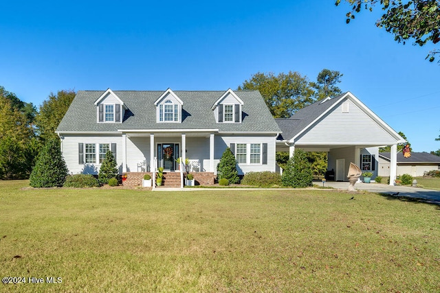 cape cod house with a carport and a front yard