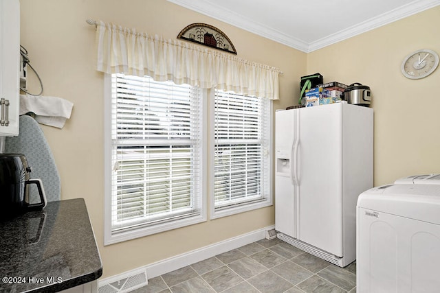 laundry area featuring crown molding