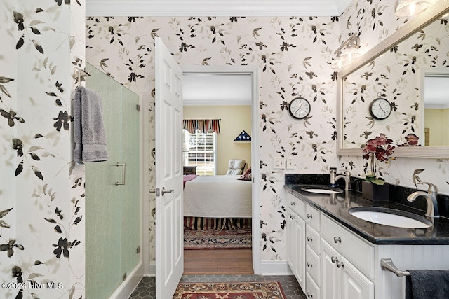 bathroom with vanity, hardwood / wood-style flooring, a shower with shower door, and ornamental molding