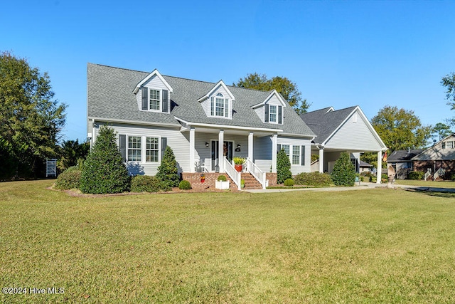 cape cod house with a front lawn