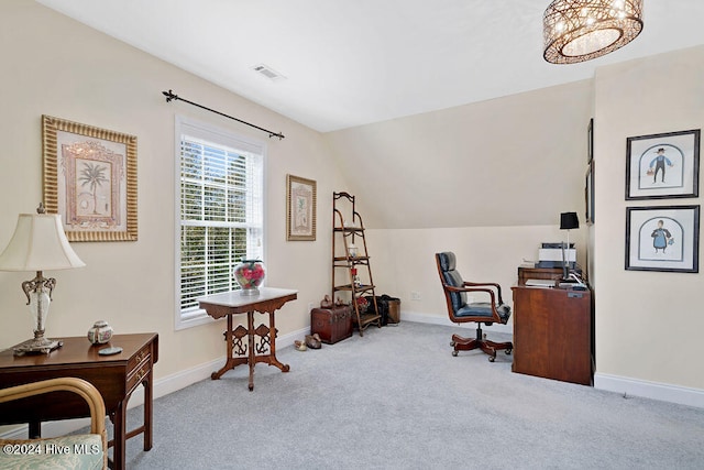 office area featuring light carpet and lofted ceiling