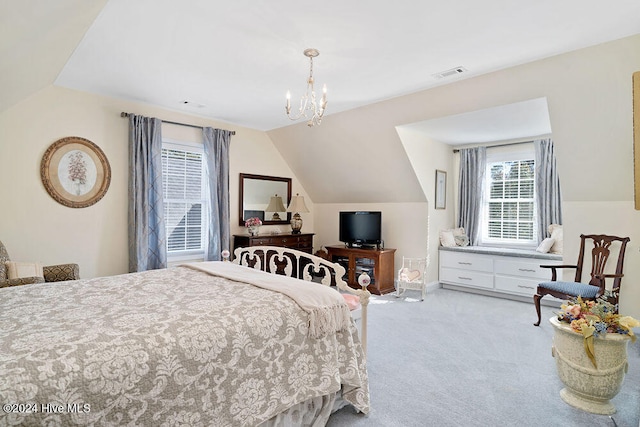 carpeted bedroom with an inviting chandelier and vaulted ceiling