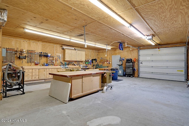 garage featuring a workshop area and a garage door opener