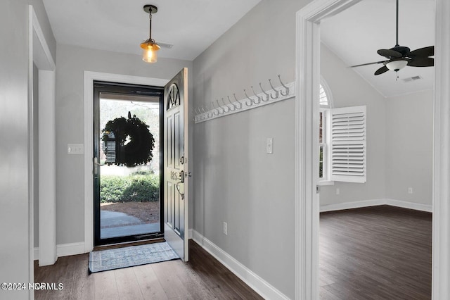 foyer entrance with ceiling fan, dark hardwood / wood-style flooring, and lofted ceiling