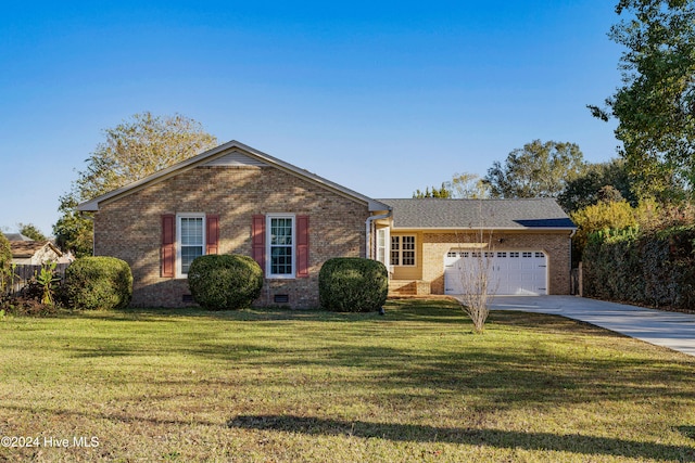 ranch-style home with a garage and a front yard