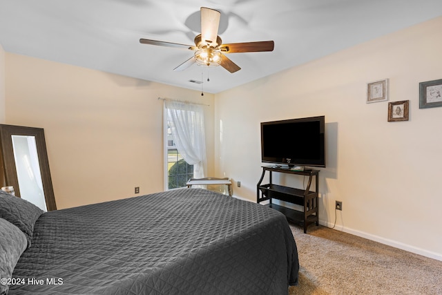 bedroom featuring ceiling fan and light colored carpet