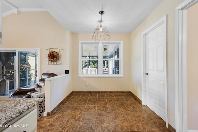 dining area with lofted ceiling